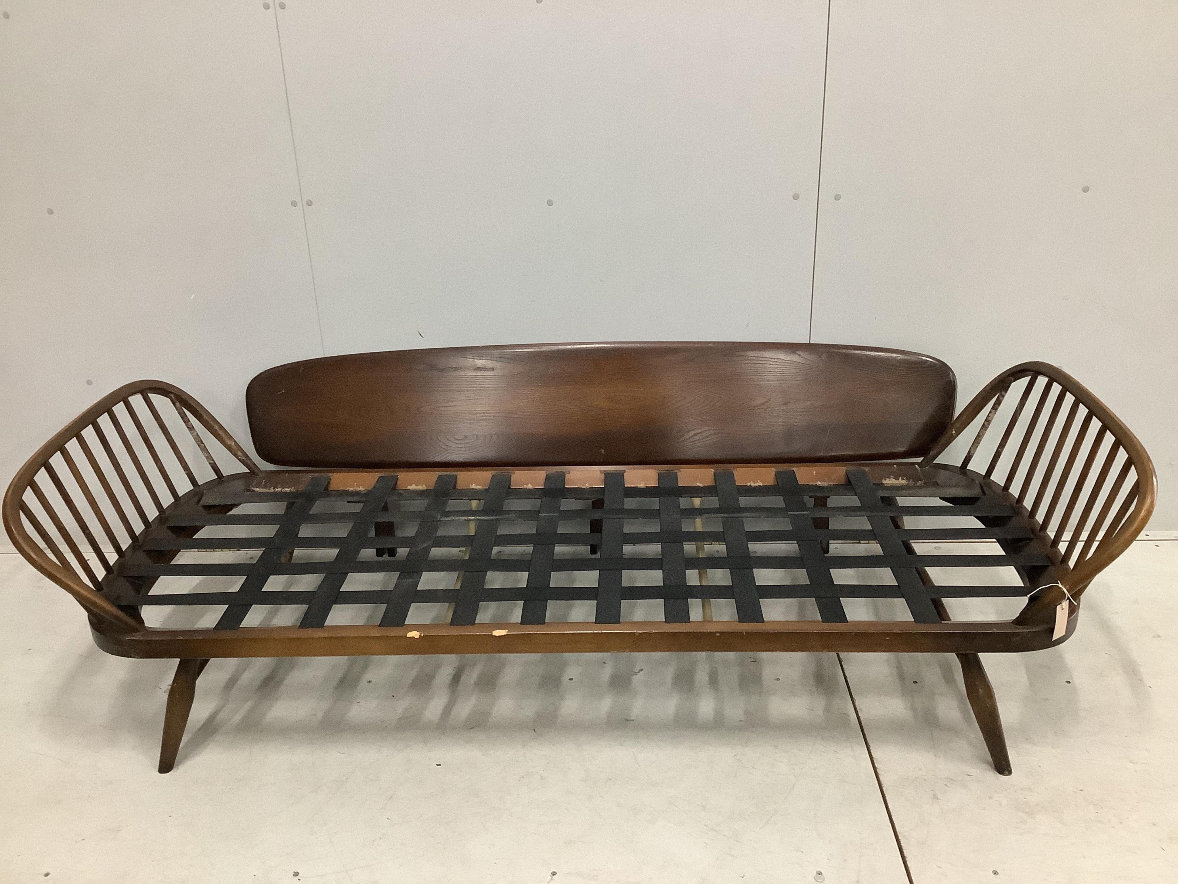 An Ercol day settee, width 208cm, depth 73cm, height 70cm. Condition - fair but missing bolts for side rail